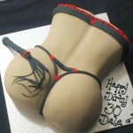 Spank-her-butt-with-black-satin-whip-pear-shaped-fanny-cake